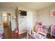 Bright bedroom featuring a television, overhead lighting and charming decorations on the walls at 1266 Hamilton Dr, Greenwood, IN 46143