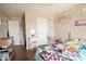 Bedroom with wooden floors, natural light, and personalized decor on the walls at 1266 Hamilton Dr, Greenwood, IN 46143