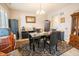 Dining room featuring a black marble table and leather chairs, with tile floors at 1266 Hamilton Dr, Greenwood, IN 46143