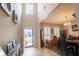 Bright entryway with high ceilings, wood floors and decorative art, leading to the living area at 1266 Hamilton Dr, Greenwood, IN 46143