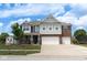 Beautiful two-story home with brick and gray siding, complemented by a lush green lawn and two-car garage at 1266 Hamilton Dr, Greenwood, IN 46143