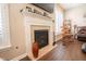Living room fireplace with tile surround and white mantel at 1266 Hamilton Dr, Greenwood, IN 46143