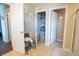 Hallway showcasing bathroom doors, a linen closet and tile flooring at 1266 Hamilton Dr, Greenwood, IN 46143