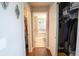 Hallway with closet leading to a bathroom featuring a shower tub combination at 1266 Hamilton Dr, Greenwood, IN 46143