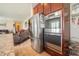 Kitchen featuring stainless steel refrigerator and double oven set into wooden cabinetry at 1266 Hamilton Dr, Greenwood, IN 46143