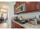 Modern kitchen featuring stainless steel appliances, granite countertops and a gas cooktop at 1266 Hamilton Dr, Greenwood, IN 46143