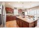 Spacious kitchen with granite counters, dark wood cabinets and stainless steel appliances at 1266 Hamilton Dr, Greenwood, IN 46143