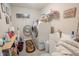 Laundry room with a washer and dryer set, laundry sink, and decorative wall art at 1266 Hamilton Dr, Greenwood, IN 46143