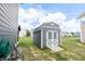 Storage shed in backyard with lawn maintenance items nearby at 1266 Hamilton Dr, Greenwood, IN 46143