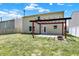 Spacious backyard featuring a pergola-covered patio, perfect for outdoor entertaining at 14373 Orange Blossom Trl, Fishers, IN 46038