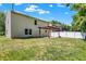 Lush backyard with a pergola-covered patio and mature trees, ideal for outdoor enjoyment at 14373 Orange Blossom Trl, Fishers, IN 46038