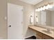 Clean bathroom featuring a vanity with a light fixture, mirror, and a doorway on the left at 14373 Orange Blossom Trl, Fishers, IN 46038