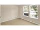 Bright bedroom featuring two windows, neutral walls, and carpeted floors creating a cozy and inviting atmosphere at 14373 Orange Blossom Trl, Fishers, IN 46038