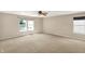 Bedroom featuring two windows offering great natural light, complemented by neutral colored carpet and walls at 14373 Orange Blossom Trl, Fishers, IN 46038