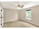 Inviting bedroom with a ceiling fan, bright window, and neutral walls, ready for comfort at 14373 Orange Blossom Trl, Fishers, IN 46038