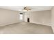 Bedroom showcasing ceiling fan, neutral carpet/walls, and natural light from a bright window at 14373 Orange Blossom Trl, Fishers, IN 46038