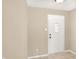 A bright foyer with a white front door and neutral-toned walls provides a welcoming entrance at 14373 Orange Blossom Trl, Fishers, IN 46038