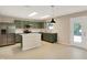 Well-lit kitchen with stainless steel appliances, a kitchen island, and ample countertop space for culinary adventures at 14373 Orange Blossom Trl, Fishers, IN 46038