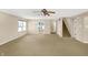 A large living room featuring neutral walls, carpeted floors and stairs leading to the second floor at 14373 Orange Blossom Trl, Fishers, IN 46038