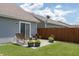 Backyard patio area with wooden bench and potted plants at 2458 Bristol Dr, Franklin, IN 46131
