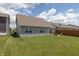 Large backyard features a green lawn, patio, and wood privacy fence at 2458 Bristol Dr, Franklin, IN 46131