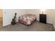 Carpeted bedroom with quilted bedspread, adjacent dresser and a guitar at 2458 Bristol Dr, Franklin, IN 46131