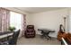Cozy bedroom featuring a brown leather recliner, musical instruments, and natural lighting at 2458 Bristol Dr, Franklin, IN 46131