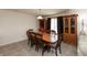 Dining room with a large wooden table and chairs, complemented by a wooden hutch and soft, neutral decor at 2458 Bristol Dr, Franklin, IN 46131