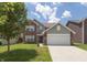 Charming two-story home with brick and vinyl siding, complemented by a well-maintained front yard and two-car garage at 2458 Bristol Dr, Franklin, IN 46131