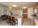 Open-concept kitchen with a large island, wooden cabinets, and access to living area, perfect for modern living at 2458 Bristol Dr, Franklin, IN 46131