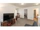 Carpeted living room with television and adjacent rooms at 2458 Bristol Dr, Franklin, IN 46131