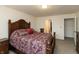 Spacious main bedroom with a decorative wood headboard, matching furniture, and neutral walls at 2458 Bristol Dr, Franklin, IN 46131
