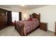 Beautiful main bedroom featuring a decorative wood headboard, neutral walls, and natural light at 2458 Bristol Dr, Franklin, IN 46131