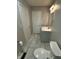 This bathroom features a white vanity and marble tiled floors at 2907 Baltimore Ave, Indianapolis, IN 46218