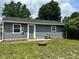 Exterior view of a single story home with blue siding and a well-maintained lawn at 2907 Baltimore Ave, Indianapolis, IN 46218