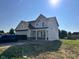 Charming two-story home with a front-entry two-car garage, bright and inviting at 3110 Montgomery Blvd, Lapel, IN 46051