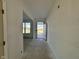 Bright hallway with clear sightlines through to a window and an open door to the exterior at 3110 Montgomery Blvd, Lapel, IN 46051
