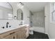 Updated bathroom with double vanity, mirrors, and modern tiled shower at 3120 S Meridian Rd, Greenfield, IN 46140