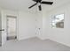 Bedroom with neutral carpeting, a ceiling fan, and a view of the yard at 3120 S Meridian Rd, Greenfield, IN 46140