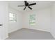 Bedroom with ceiling fan, two windows and neutral carpeting at 3120 S Meridian Rd, Greenfield, IN 46140