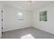 Bright bedroom with a pair of windows and neutral carpeting at 3120 S Meridian Rd, Greenfield, IN 46140