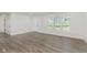 Bright living room with new floors and large windows at 3120 S Meridian Rd, Greenfield, IN 46140
