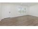 Bright living room with new floors and large windows at 3120 S Meridian Rd, Greenfield, IN 46140