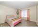 Cozy bedroom with warm tones and a window, offering comfortable living at 3624 Newberry Rd, Plainfield, IN 46168