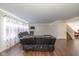Spacious living room features dark wood floors, a fireplace, and cozy seating at 3624 Newberry Rd, Plainfield, IN 46168