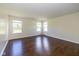 A bright living room with wood floors, and many windows filling the space with light at 3624 Newberry Rd, Plainfield, IN 46168