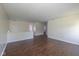 Spacious living room featuring rich hardwood floors and neutral paint scheme, perfect for entertaining or relaxing at 3624 Newberry Rd, Plainfield, IN 46168