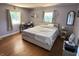 Bedroom with natural light, hardwood floors, and neutral decor creates a peaceful atmosphere at 4106 N Sherman Dr, Indianapolis, IN 46226