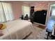 Bedroom with white carpet and pink color scheme, workspace, and art on wall at 4106 N Sherman Dr, Indianapolis, IN 46226