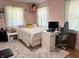 Bedroom with white carpet and natural lighting, and a work area at 4106 N Sherman Dr, Indianapolis, IN 46226